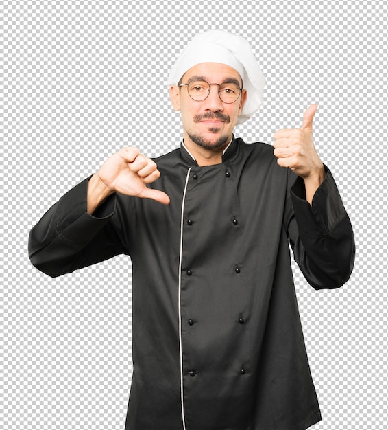 PSD hesitant young chef gesturing that everything is fine