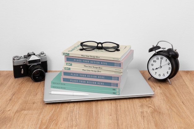 High angle books, camera and glasses