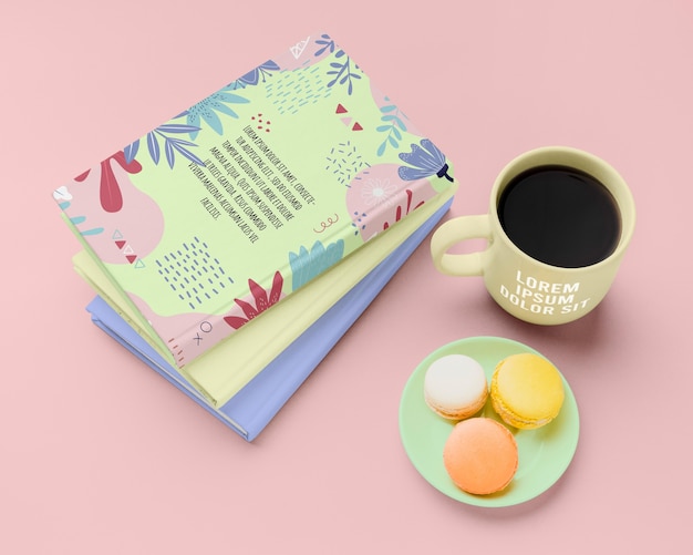 High angle books with macarons and coffee