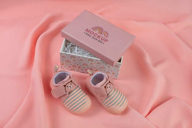 High angle box and baby shoes