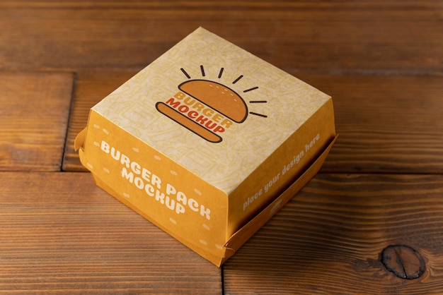 PSD high angle burger box on wooden background