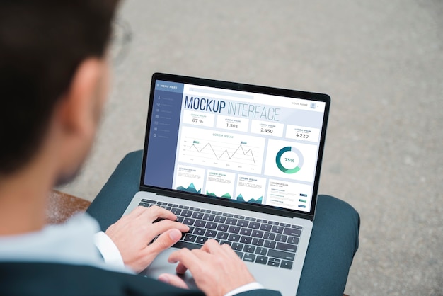 High angle of businessman working on laptop