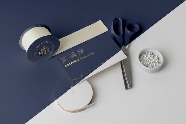 high angle of carnival invitation with tape and beads