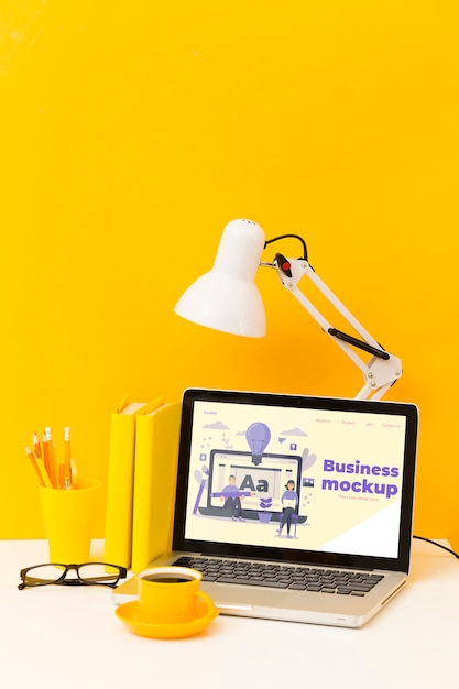 High angle of desk with laptop and coffee