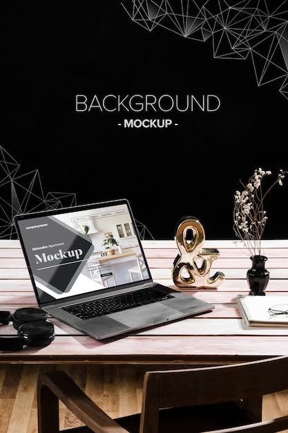 high angle of desk with laptop and decorations