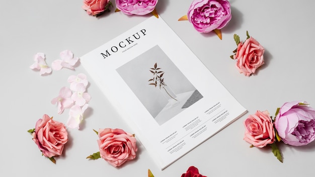 High angle magazine and flowers mockup