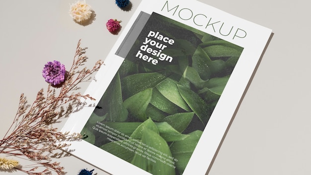 high angle magazine and flowers