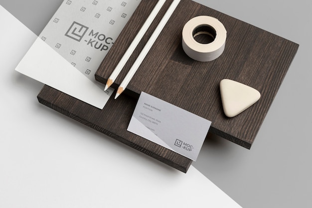 high angle mock-up stationery on wood composition