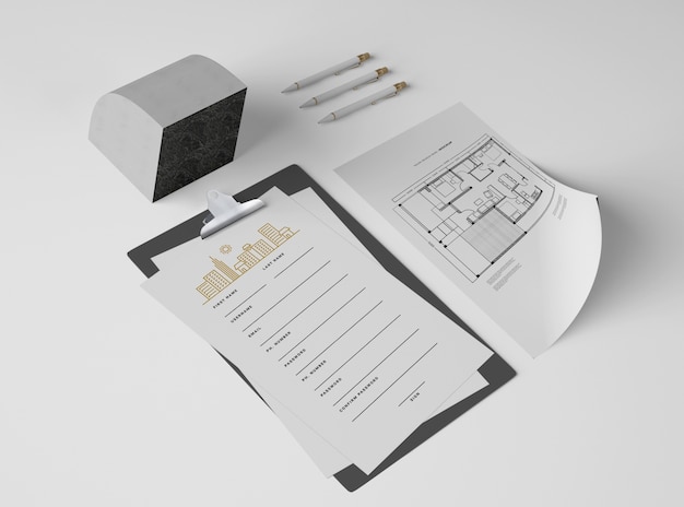 PSD high angle of notepad with papers and plan