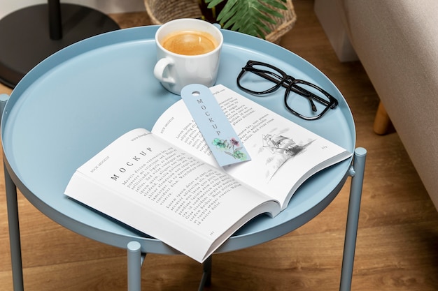 high angle open book mock-up on coffee table with bookmark