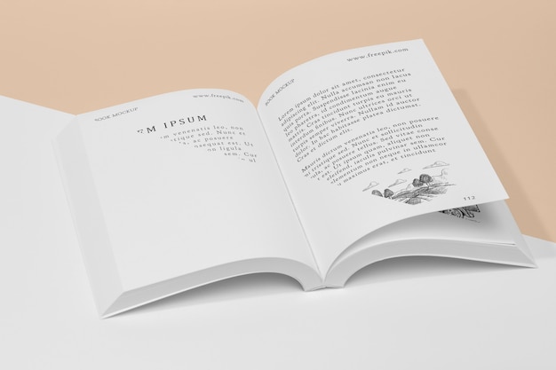 Mock-up libro aperto ad alto angolo con illustrazione