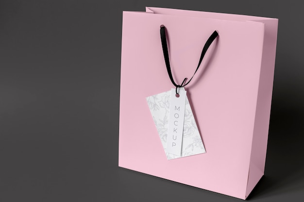 High angle of paper shopping bag mock-up with paper tag