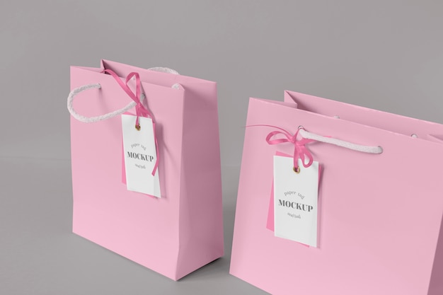 PSD high angle of paper shopping bag mock-up with paper tag