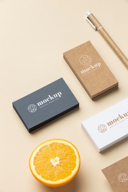 PSD high angle of paper stationery with citrus and pen