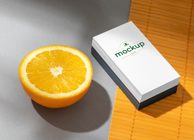 High angle of paper stationery with citrus