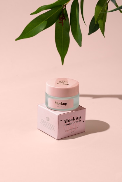 high angle pink cream container and leaves