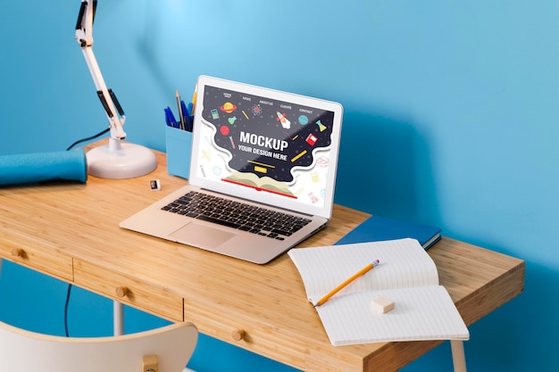 High angle of school desk with laptop