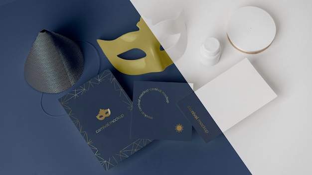 High angle of simplistic carnival invitation with mask and cone