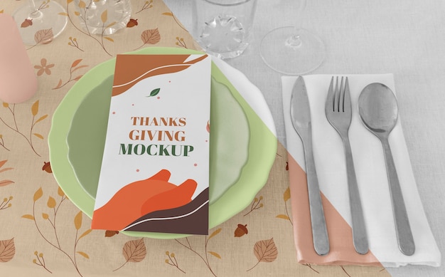 High angle of thanksgiving dinner table arrangement with cutlery and plates