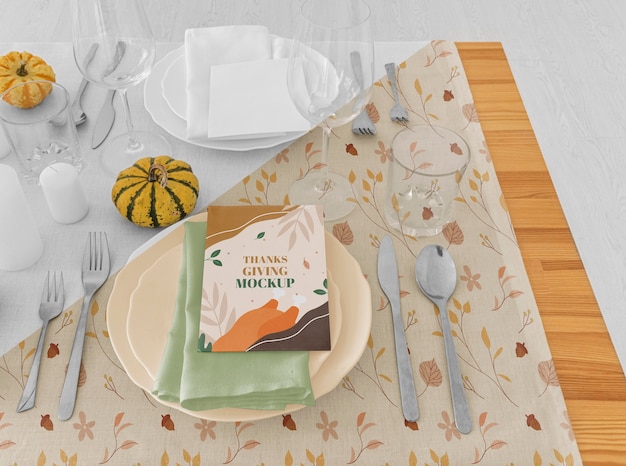 High angle of thanksgiving dinner table arrangement with plates
