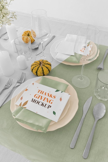 PSD high angle of thanksgiving dinner table arrangement with pumpkins