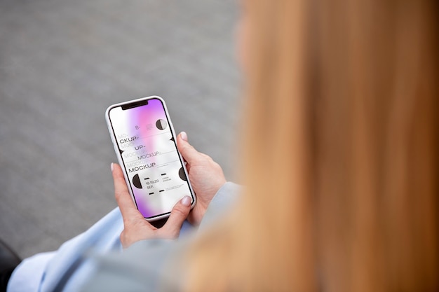 High angle woman holding smartphone