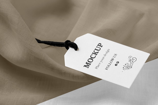 High view mock-up of clothing labels on soft fabric