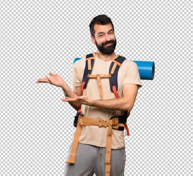 Hiker man extending hands to the side for inviting to come