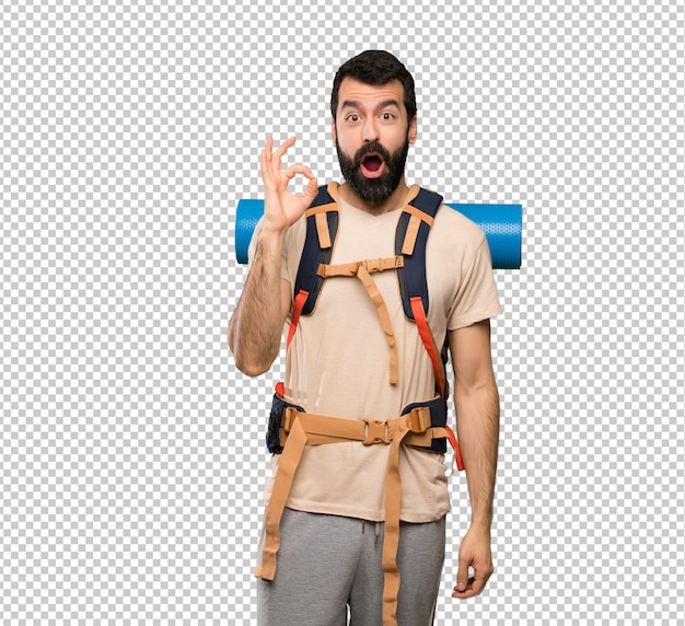 Hiker man surprised and showing ok sign