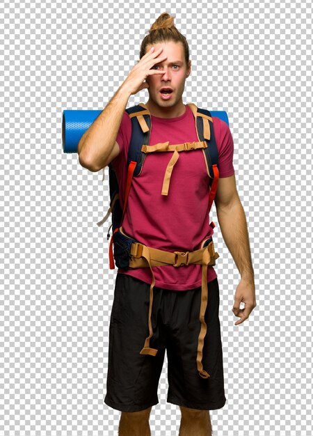 PSD hiker man with mountain backpacker with surprise and shocked facial expression