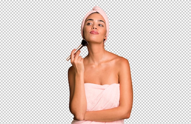 PSD hispanic pretty young adult and expressive woman wearing bathrobe beauty and make up concept