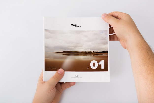 Holding Closed Square Magazine Mockup