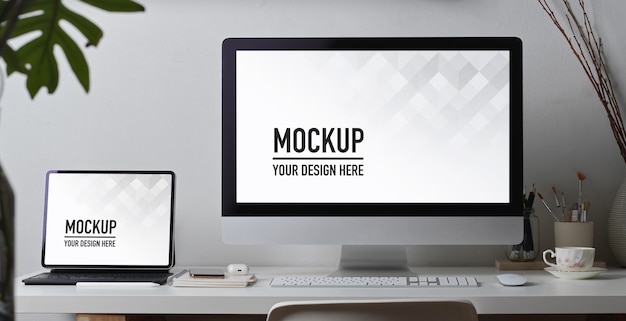 Home office desk with computer, tablet, supplies mockup and decoration