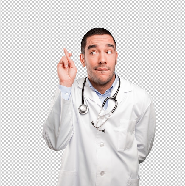 PSD hopeful young doctor doing finger cross gesture