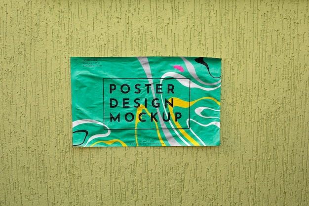 Horizontal poster mockup on wall