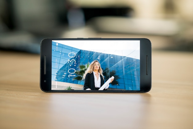 Horizontal smartphone mockup on table