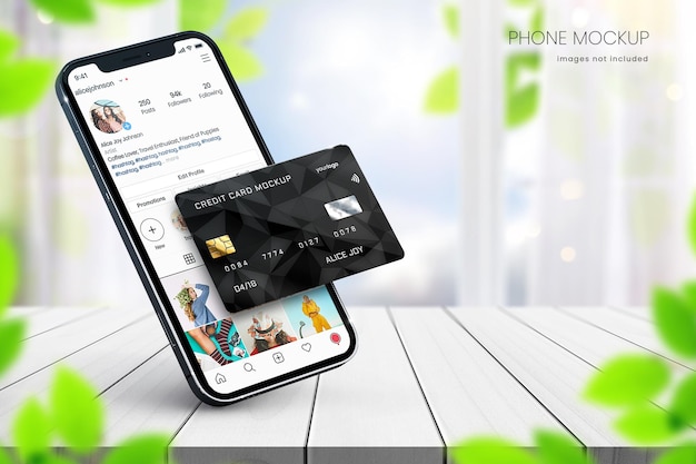 Instagram smartphone mockup and credit card mockup on white wood table with blue sky in background