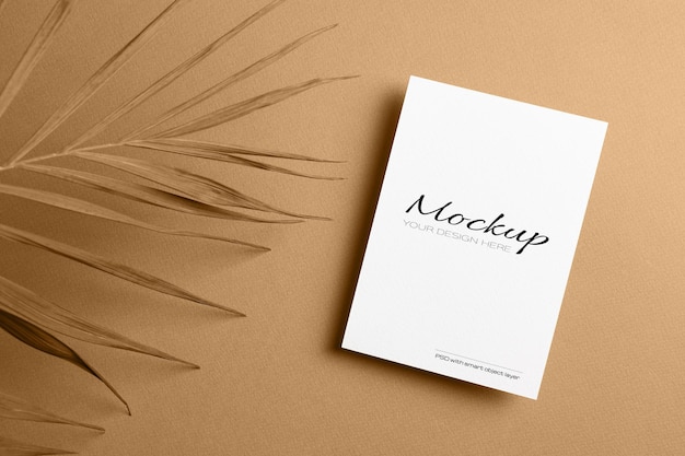 invitation card or flyer, stationary mockup with dry nature palm leaf