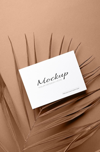 invitation card or flyer, stationary mockup with dry nature palm leaf