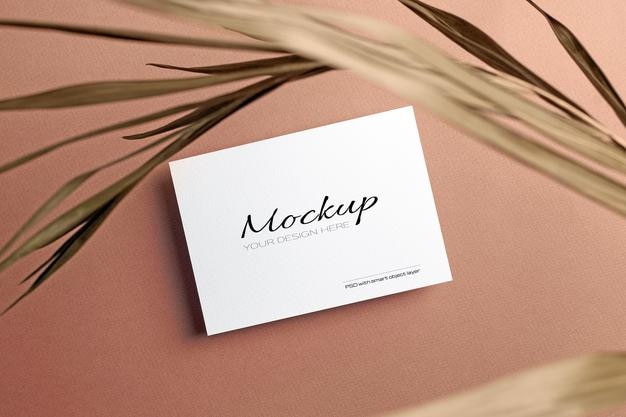 Invitation card or flyer, stationary mockup with dry nature palm leaf