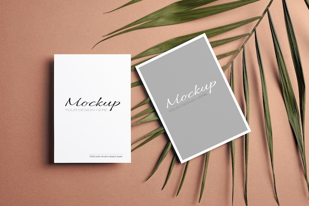 Invitation card or flyer, stationary mockup with front and back sides and palm tree leaf