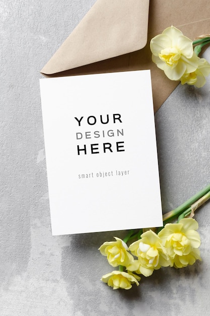 PSD invitation card mockup with envelope and daffodils flowers