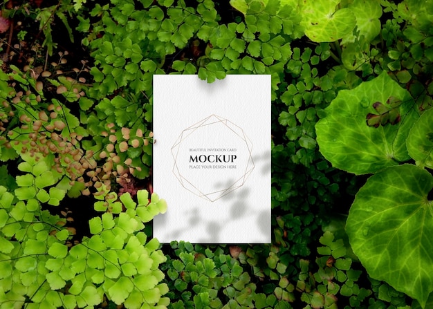 PSD invitation card mockup with greenery.