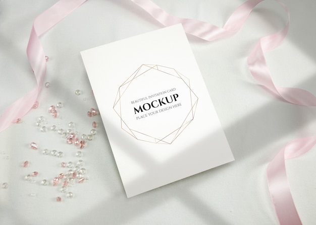 Invitation card mockup with ribbon.