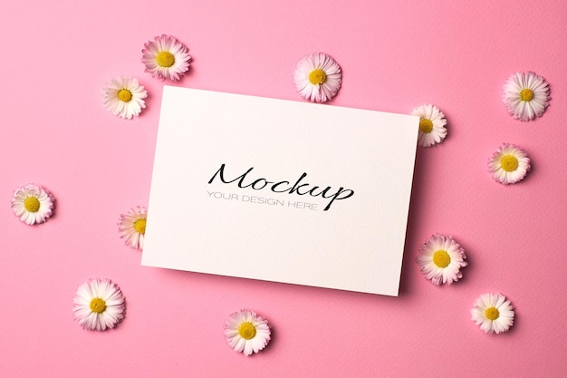 PSD invitation or greeting card mockup with daisy flowers on pink