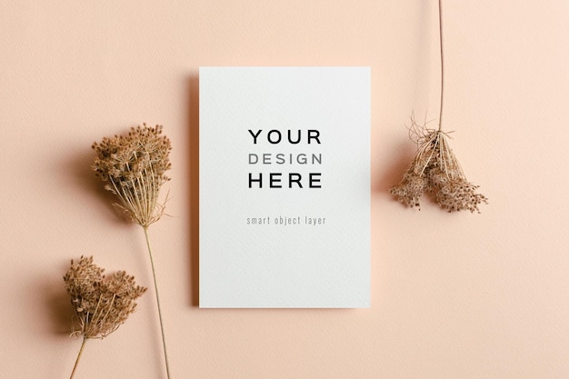 Invitation or greeting card mockup with dry plant flowers