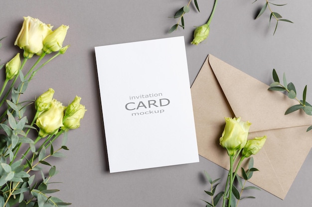 Invitation or greeting card mockup with envelope and flowers