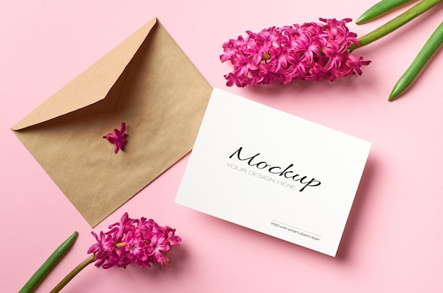 Invitation or greeting card mockup with envelope and hyacinth flowers