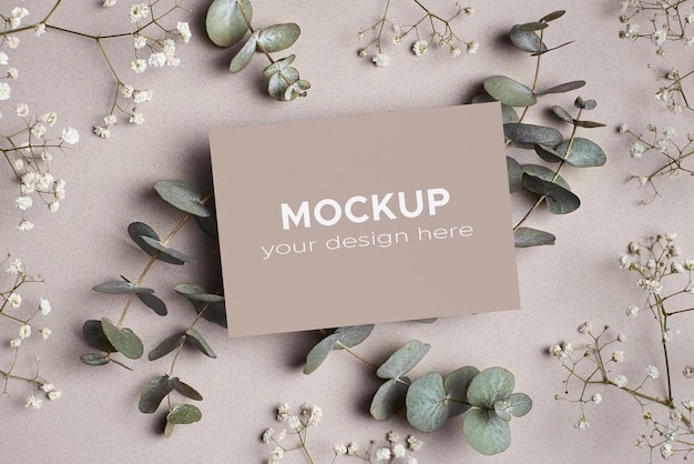 PSD invitation or greeting card mockup with eucalyptus and hypsophila flowers