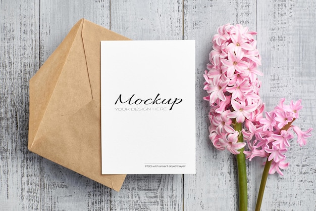 Invitation or greeting card mockup with pink hyacinth flower 
